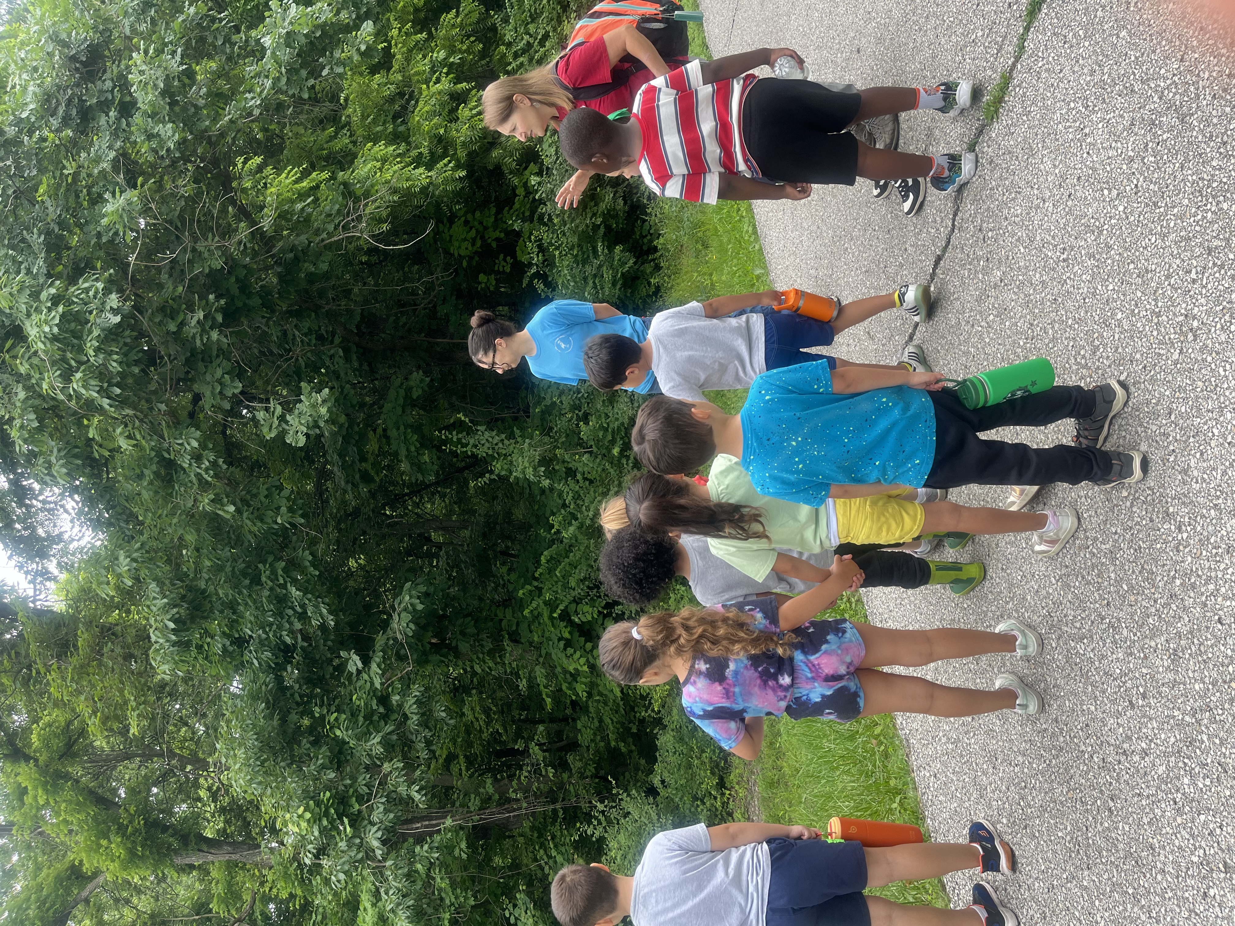 group of children standing on a roadway preparing for a hike at Wyandotte County Lake near Mr. & Mrs. F. L. Schlagle Library