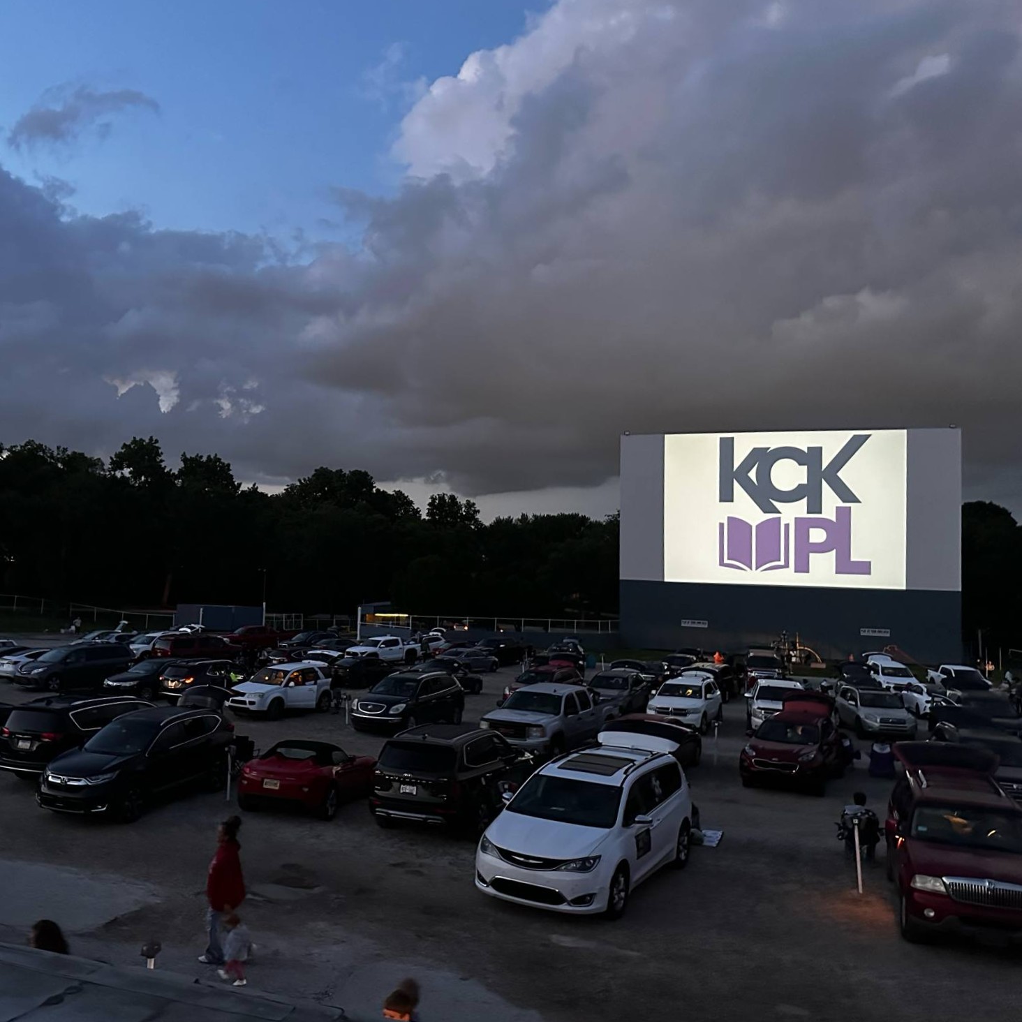 kckpl logo on screen at boulevard drive-in movie at  summer reading kickoff party 2025