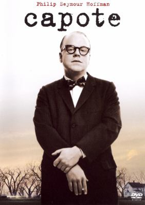 Capote DVD cover showing a man in a black tuxedo with a small white house and trees in the background