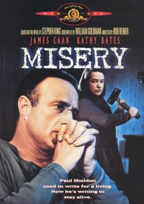 Misery DVD cover showing a man with hands clasped at his face and a woman in the background ready to swing a sledge hammer