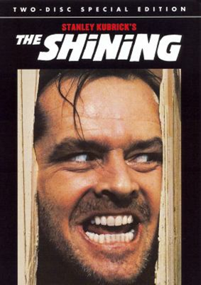 The Shining DVD cover showing a man with a crazed look sticking his head through a broken door frame
