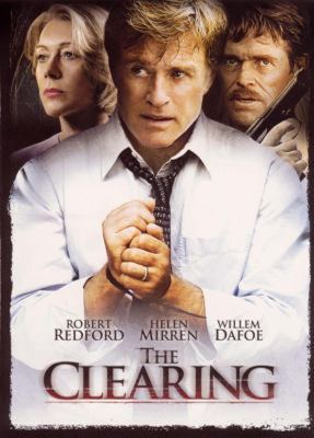The Clearing dvd cover; man wearing shirt and tie handcuffs on his hands