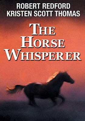 The Horse Whisperer dvd cover; horse running and backlight by a reddish light