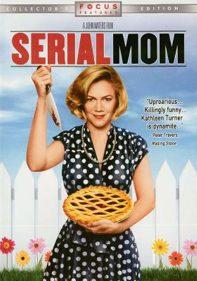 Serial Mom dvd cover; woman in front of a white picket fence holding a pie in one hand and a knife in the other