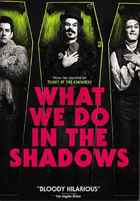 What We Do in the Shadows dvd cover; three men lying in coffins, each with one eye open and one eye closed