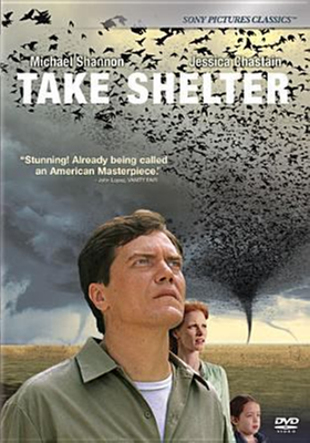 Take Shelter dvd cover; man, woman, and child looking skyward with a tornado of birds in the background