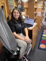 portrait of Alex, a mobile services associate on the KCKPL mobile library bus