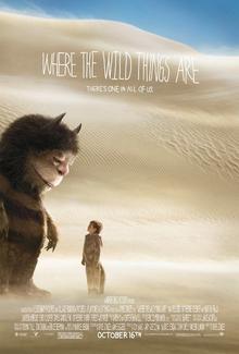 Movie poster for Where the Wild Things Are showing one of the Wild Things and Max staring at each over surrounded by sand.