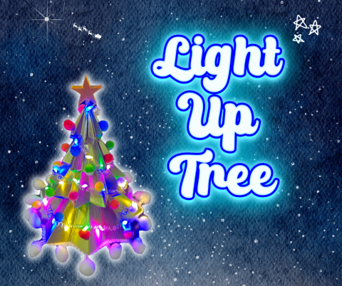 A 3D printer tree covered in lights and pom pom garland.