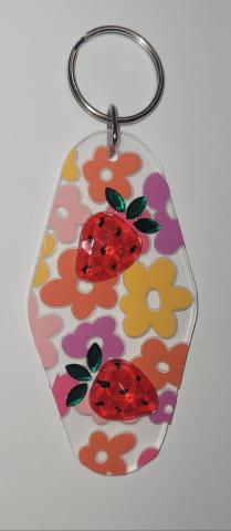 Keychain decorated with colorful flowers and rhinestone strawberries