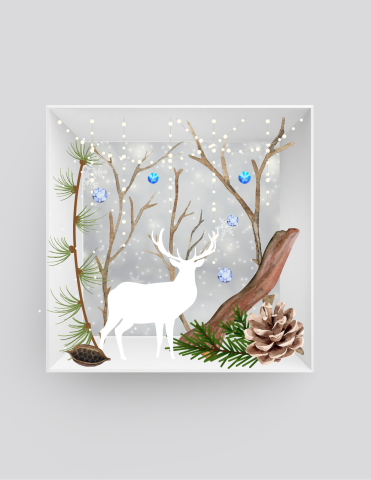 shadow box with winter decorative elements and a deer silhouette