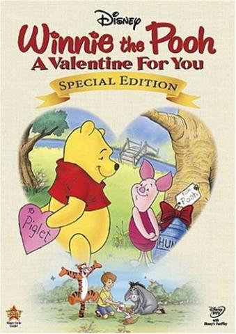 Winnie holding a pink heart behind his back with Piglet standing in front of him, both in a heart shaped cut out. Title of the movie is at the top. 