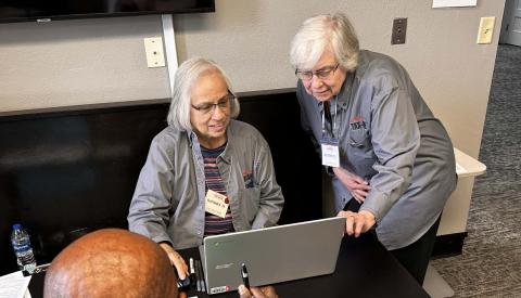 AARP volunteers preparing taxes for patrons. 