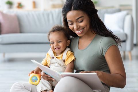 Caregiver reading to infant