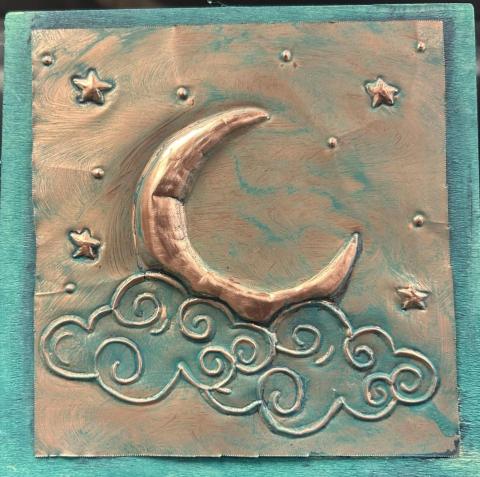 Embossed Copper Art. Copper molded into the shape of a crescent moon, clouds and stars.