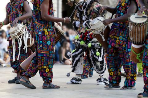 African drummers in colorful outfits