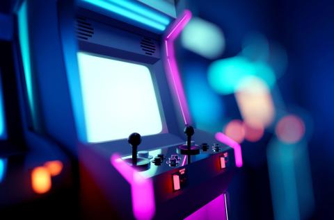 Retro neon glowing arcade machine in a game room
