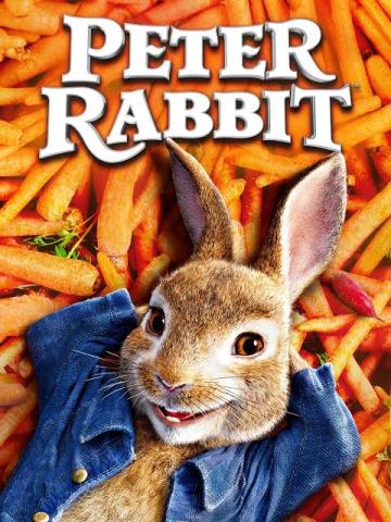 Peter Rabbit laying on bed of carrots