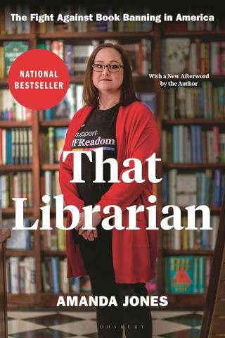 That Librarian by Amanda Jones book cover; woman dressed in black and a long red sweater standing in front of bookshelves