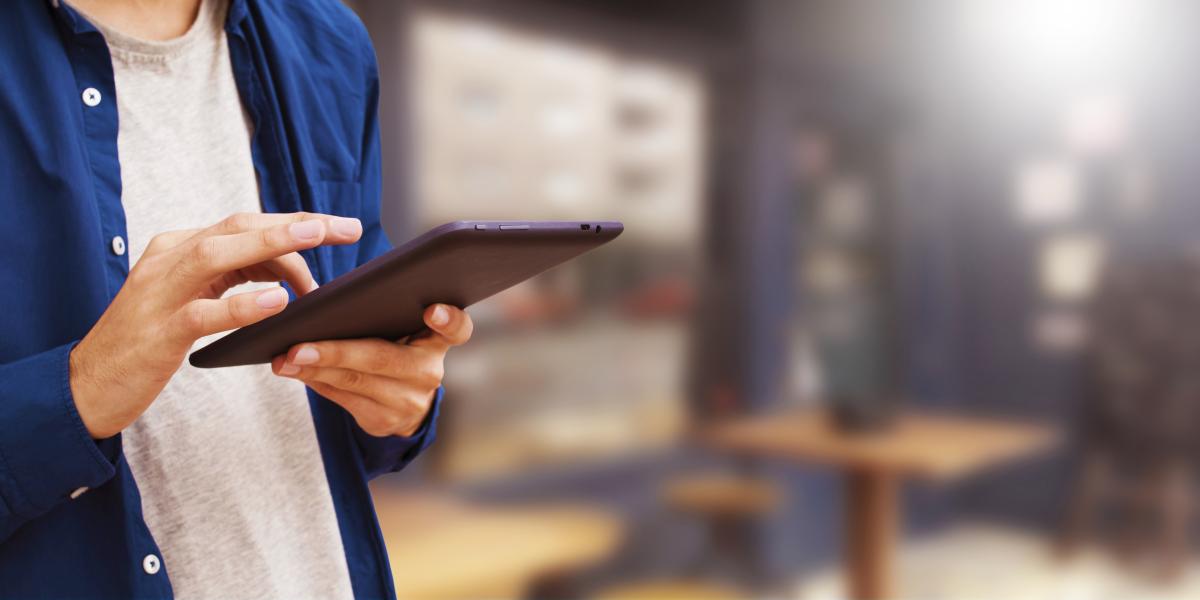 White women holding a tablet