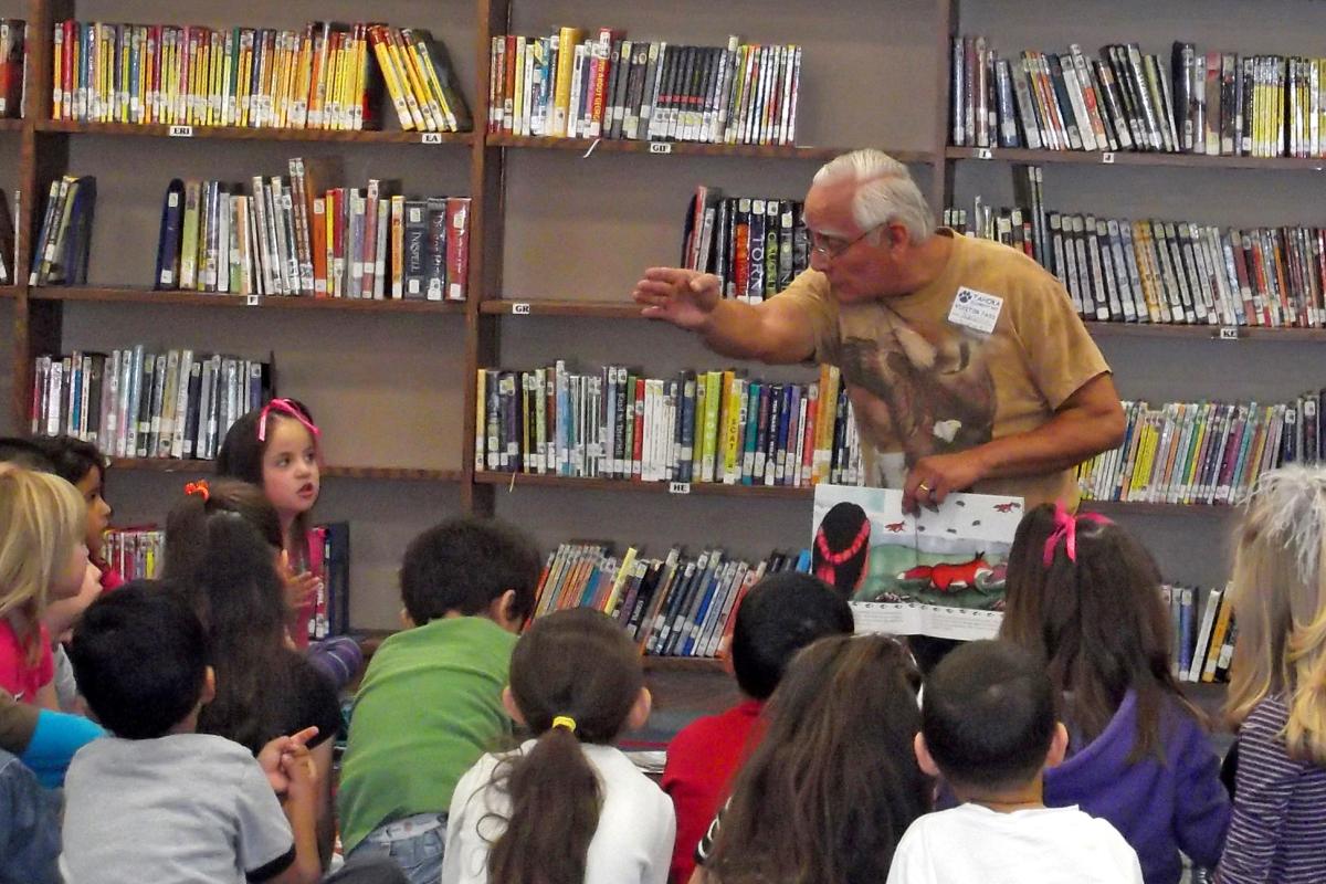 Ralph "Little Eagle" Williston with a group of eager and enraptured listeners.