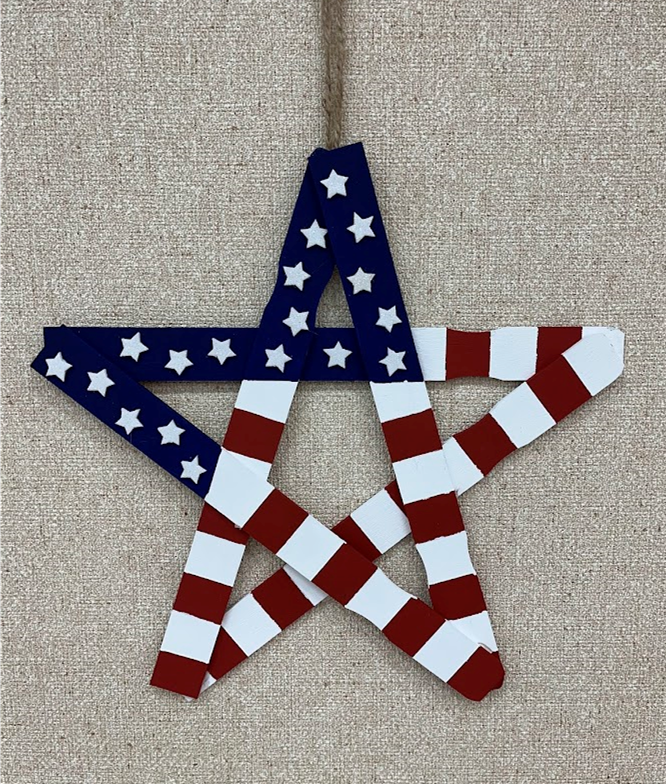 American flag made out of paint stir sticks.