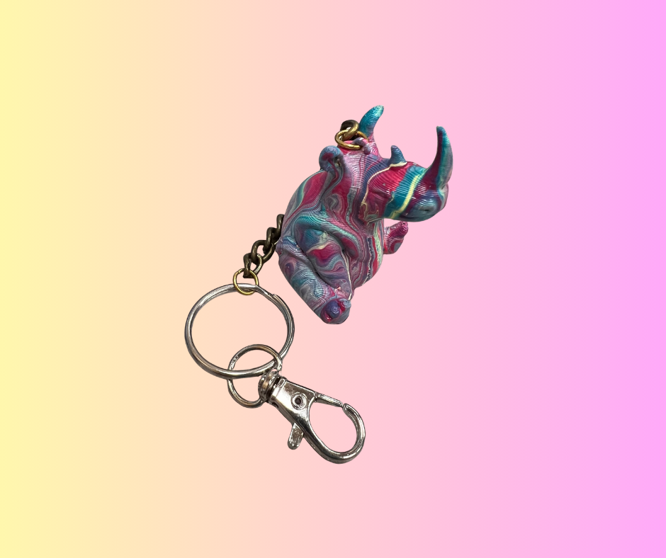 small rhino figurine painted with a keychain attached