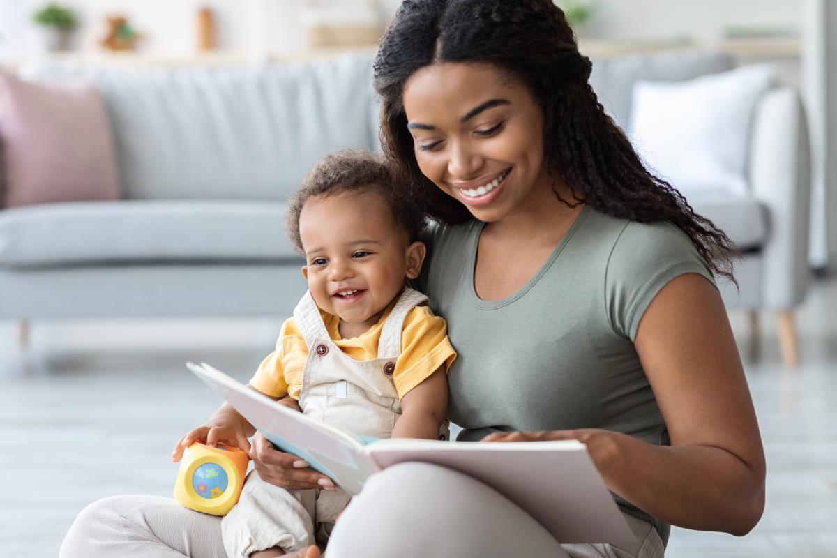 Woman reading to baby 