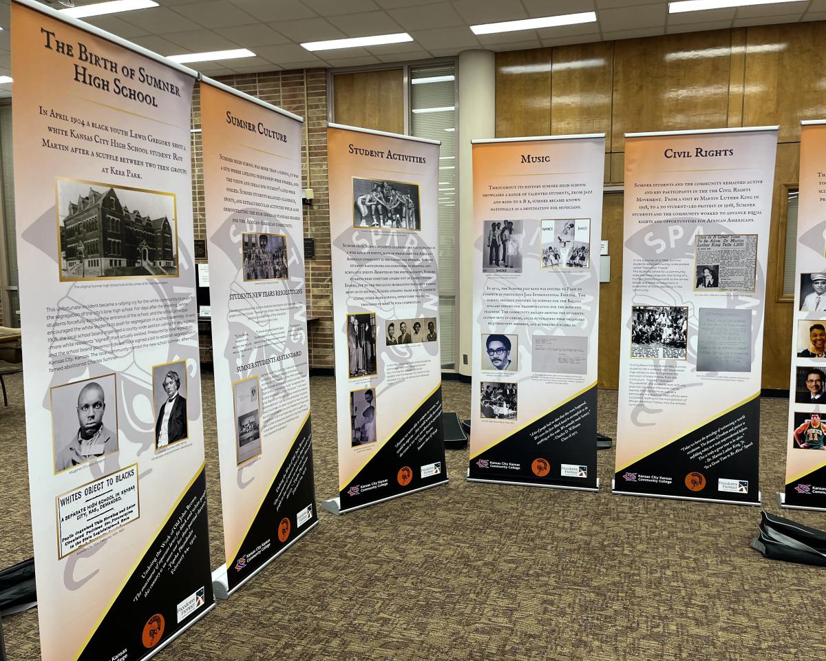 poster display stands featuring info about Sumner High School history