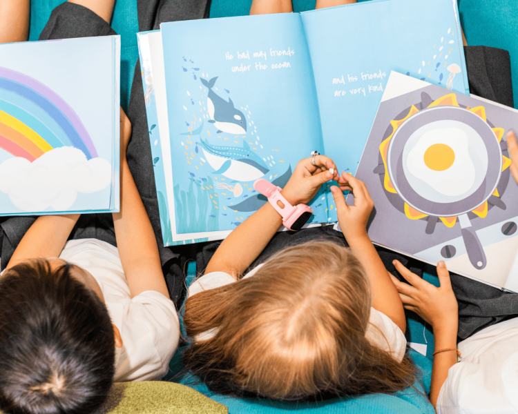 looking down on children reading story books